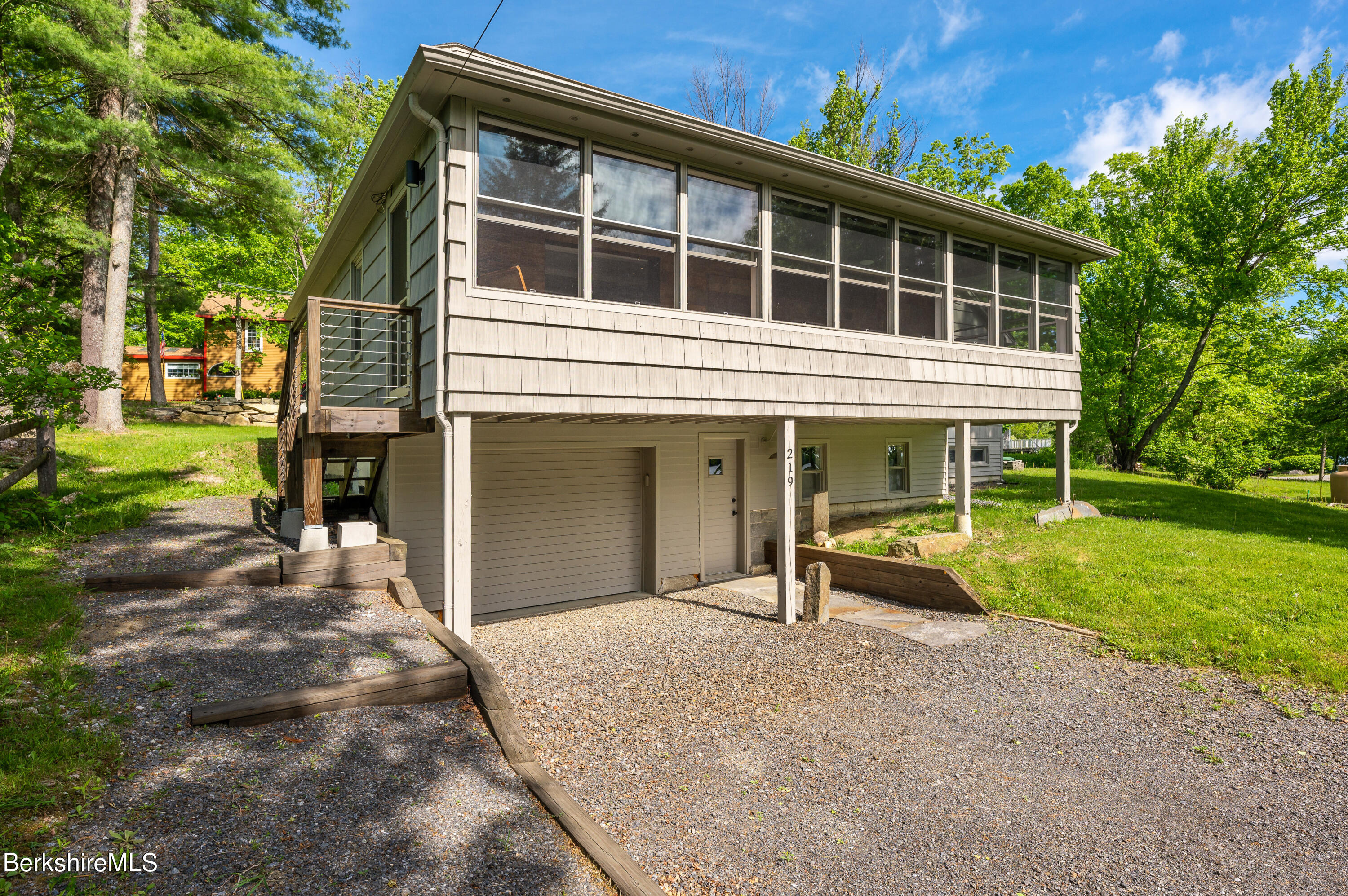 219 Shore Road Richmond, MA 01201 - Photo 18 of 28 a front view of a house with garden and porch
