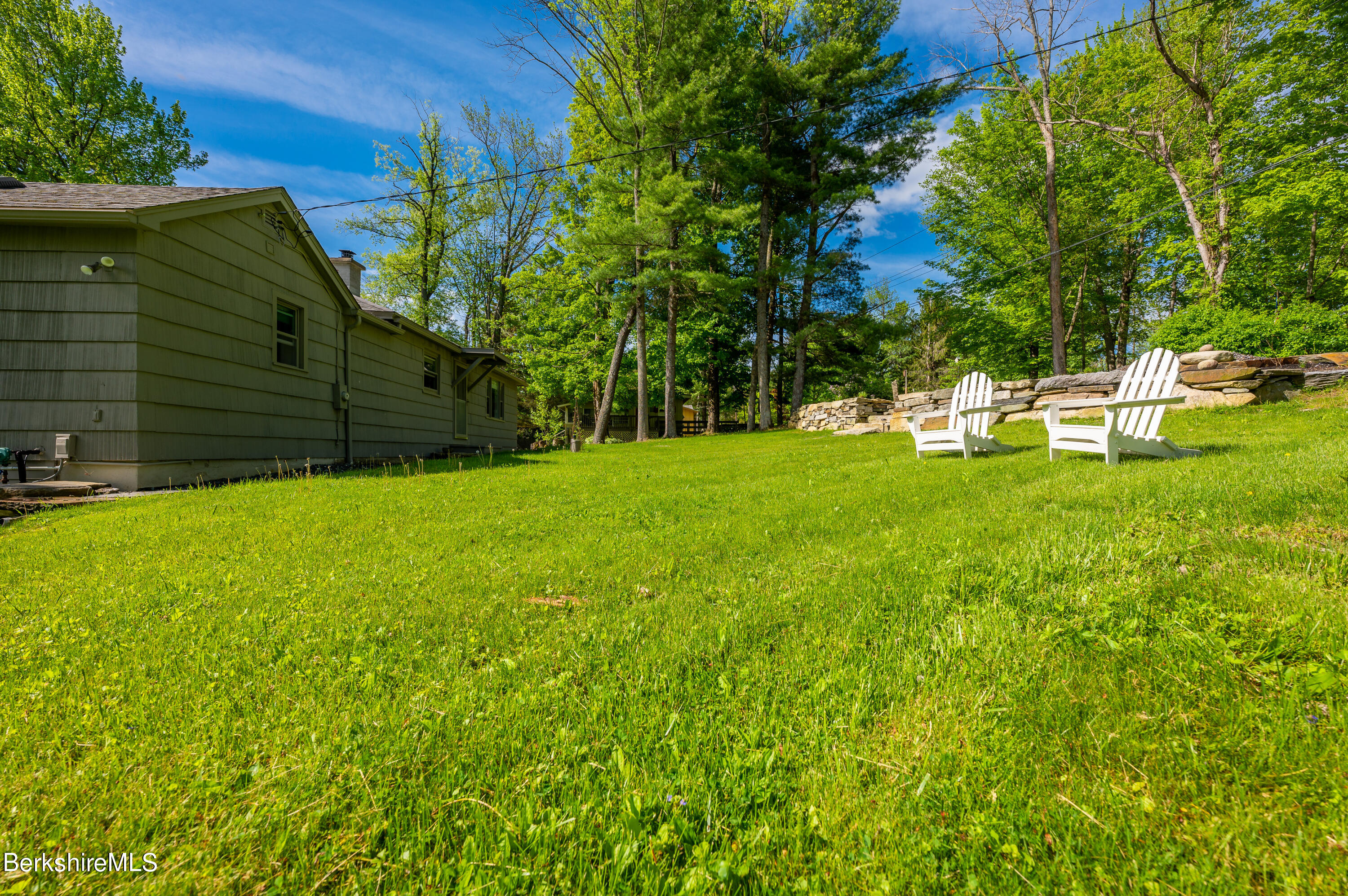 219 Shore Road Richmond, MA 01201 - Photo 27 of 28 a view of a backyard with a small cabin