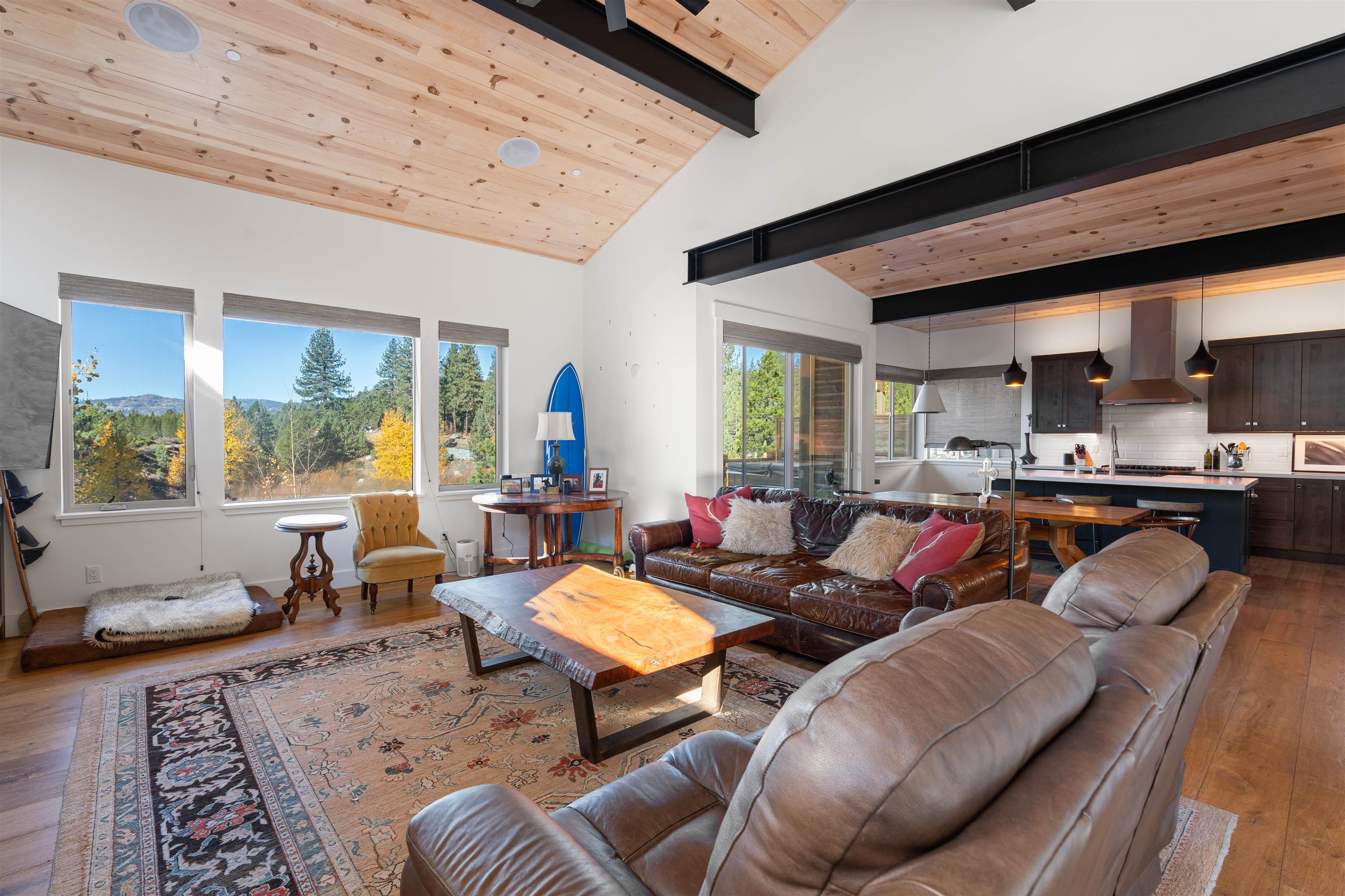 11658 McClintock Loop Truckee, CA 96161 - Photo 3 of 13 a living room with furniture wooden floor and a large window