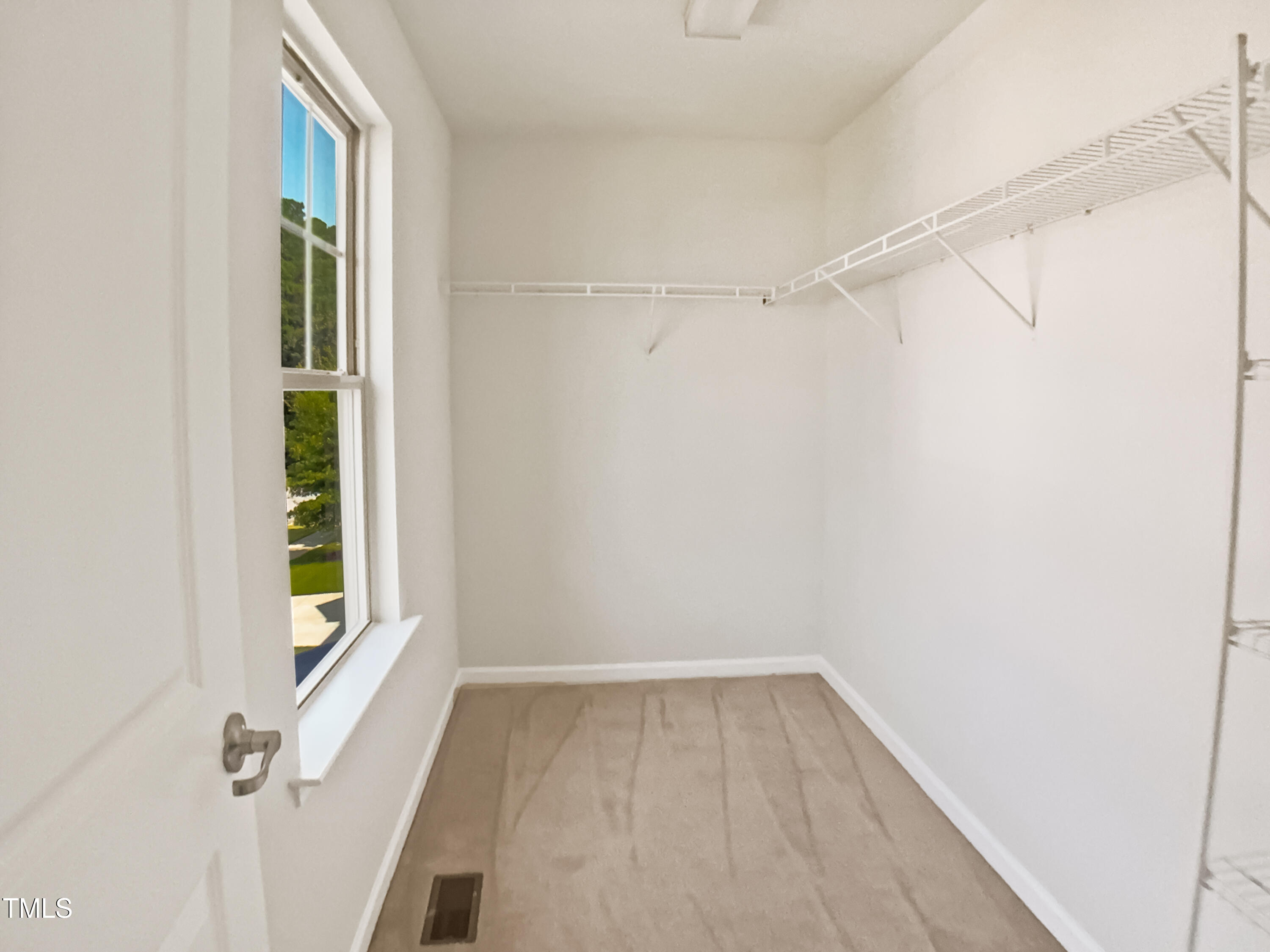 617 Hiddenbrook Drive Durham, NC 27703 - Photo 23 of 26 a view of an empty room with a window
