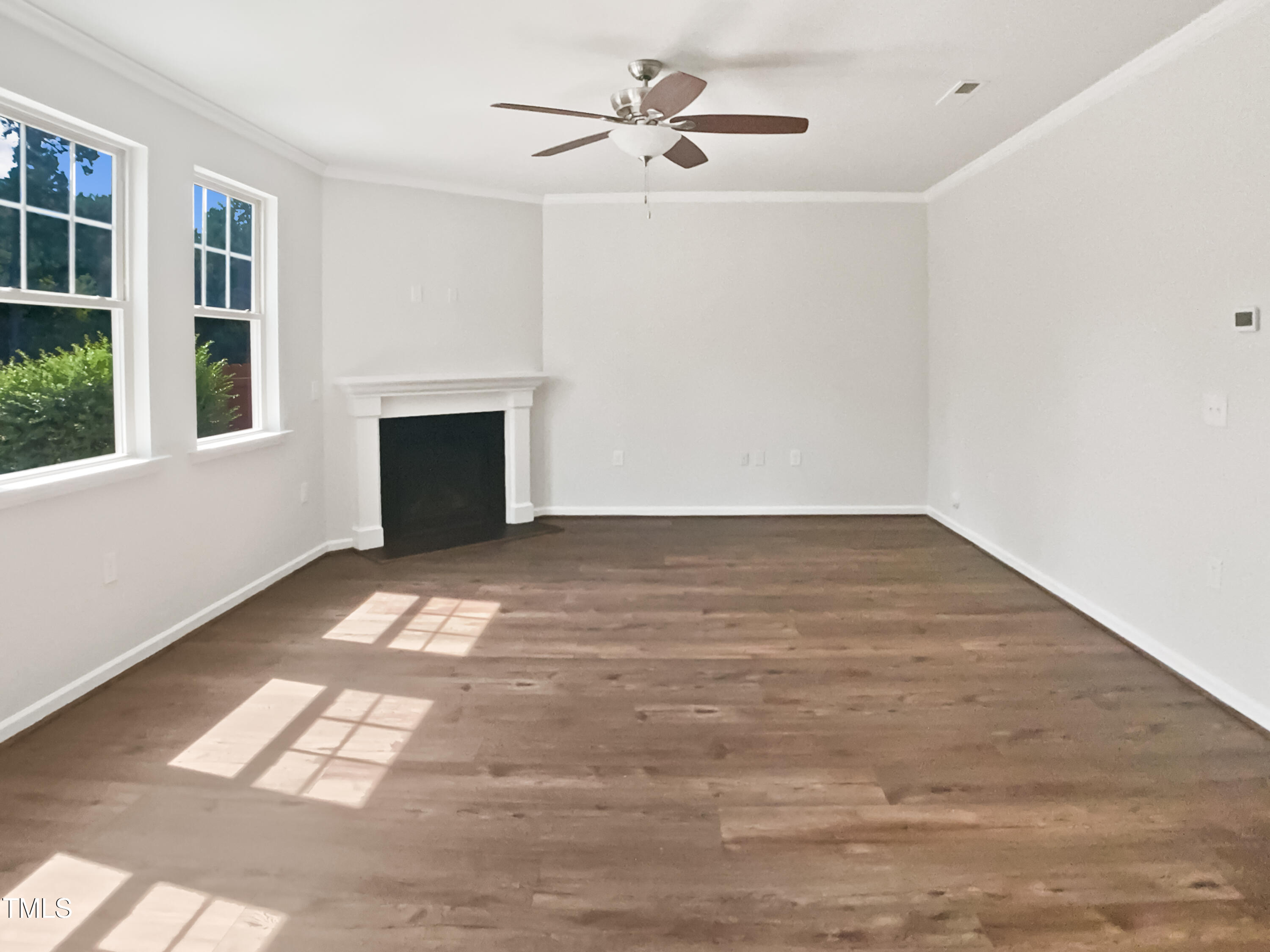 617 Hiddenbrook Drive Durham, NC 27703 - Photo 6 of 26 wooden floor in an empty room with a window
