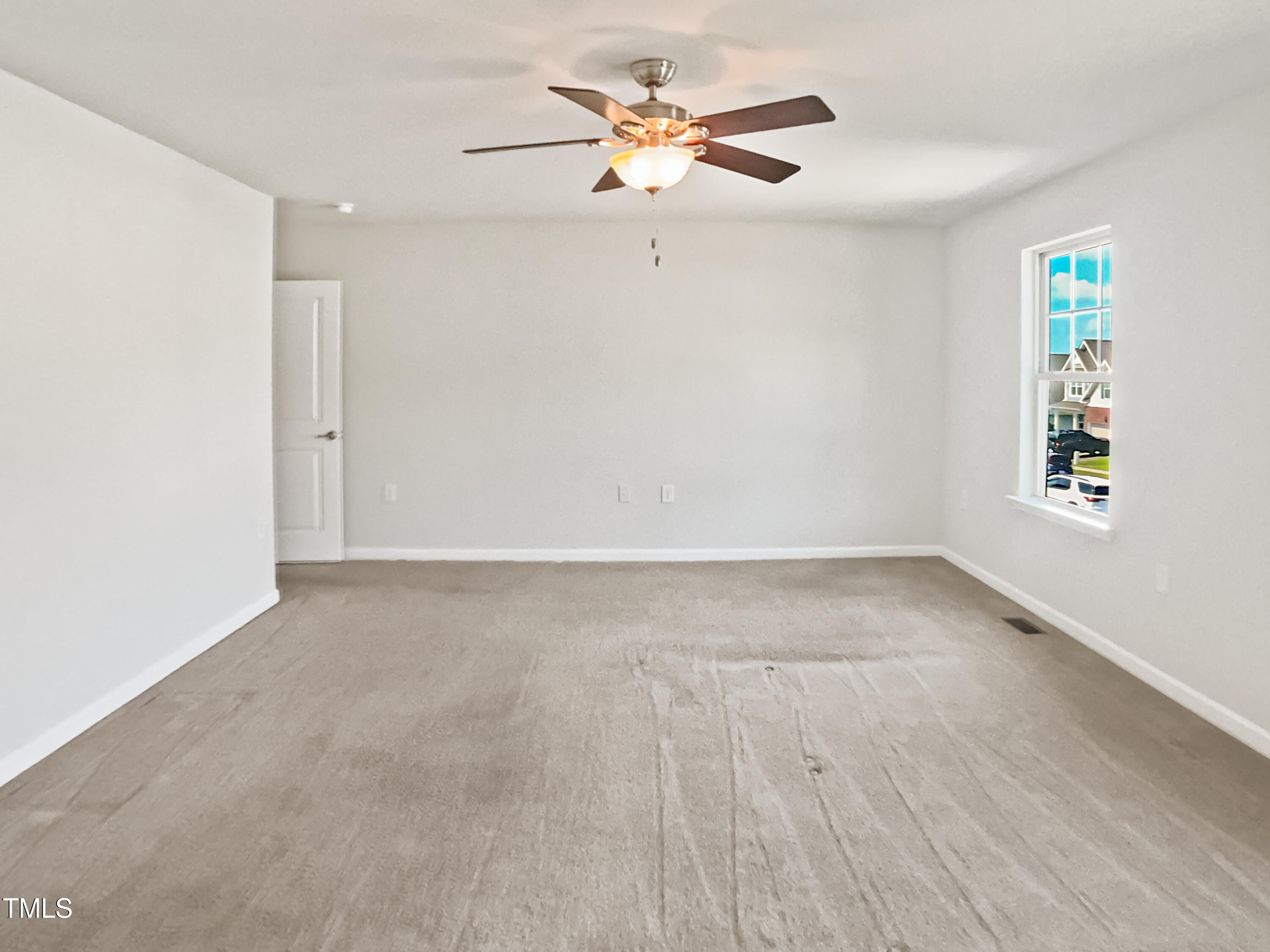 617 Hiddenbrook Drive Durham, NC 27703 - Photo 7 of 26 wooden floor in an empty room with a window