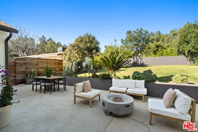 a patio with patio a couch and chairs