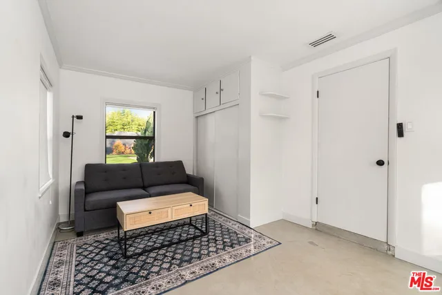 a bed room with a bed and a window