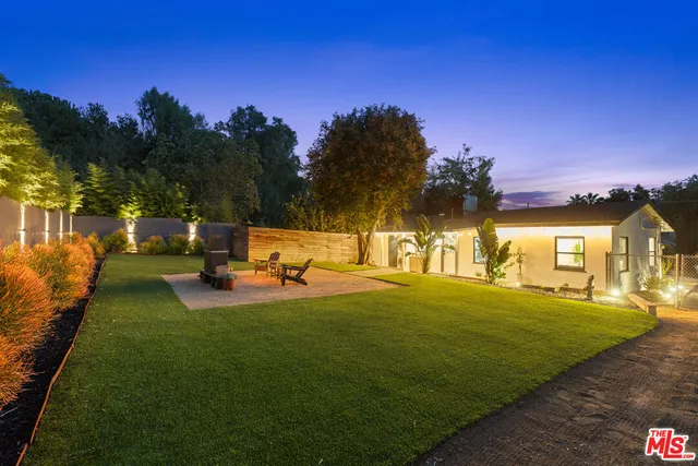 a view of a park with large trees