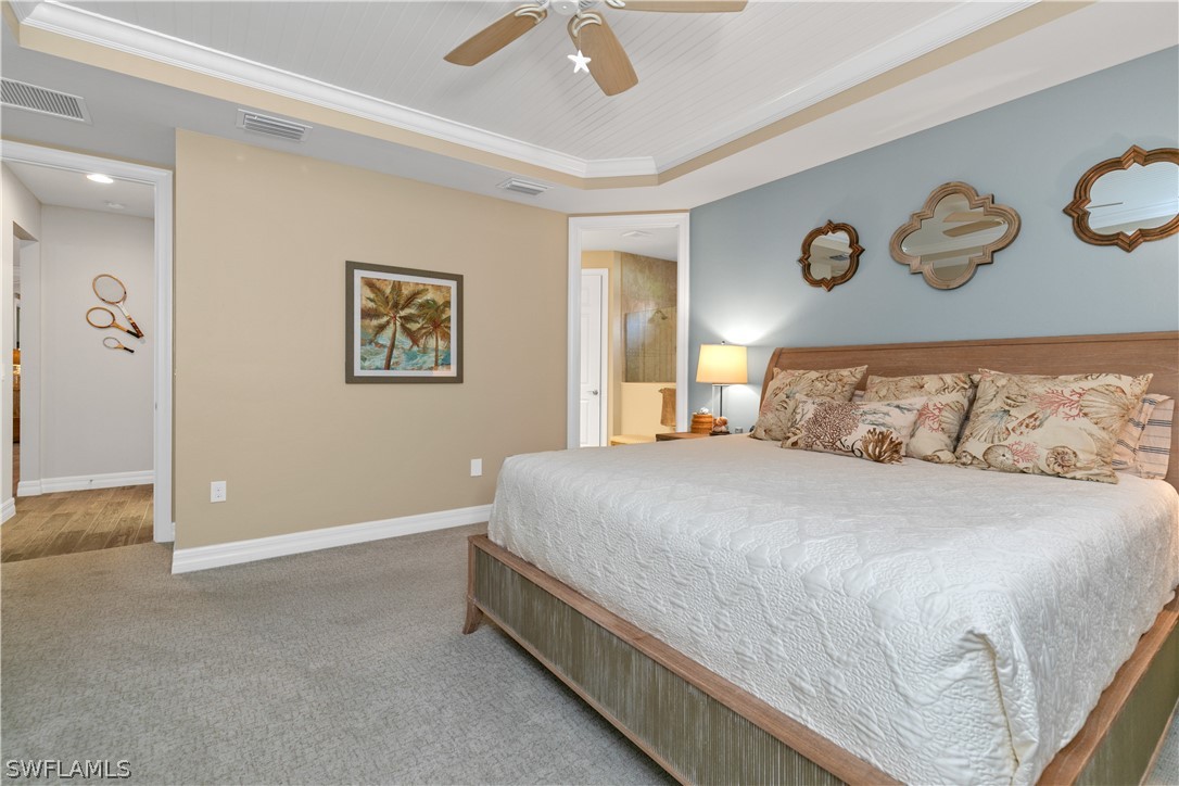 10832 Dennington Road Fort Myers, FL 33913 - Photo 13 of 34 a bedroom with a bed and painting on the wall