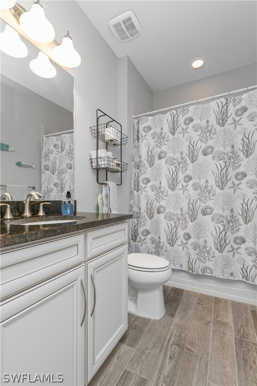 10832 Dennington Road Fort Myers, FL 33913 - Photo 19 of 34 a bathroom with a toilet sink and mirror