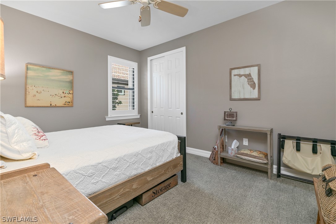 10832 Dennington Road Fort Myers, FL 33913 - Photo 20 of 34 a bedroom with a bed and a ceiling fan