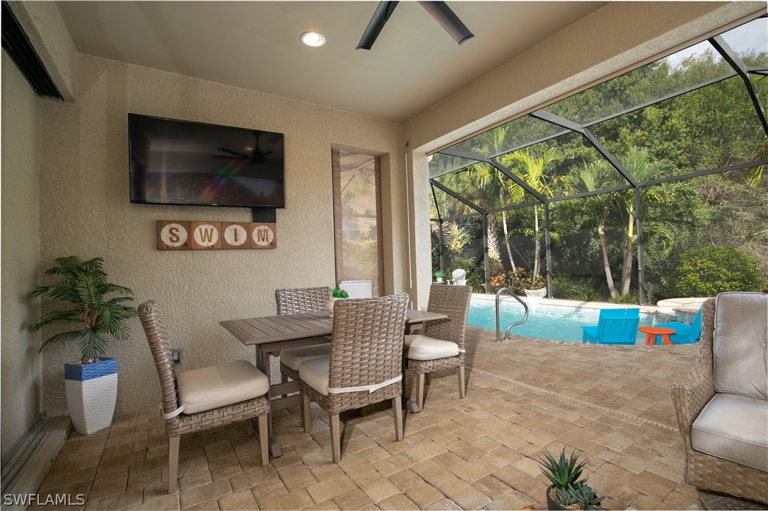 10832 Dennington Road Fort Myers, FL 33913 - Photo 22 of 34 a living room with furniture and a flat screen tv