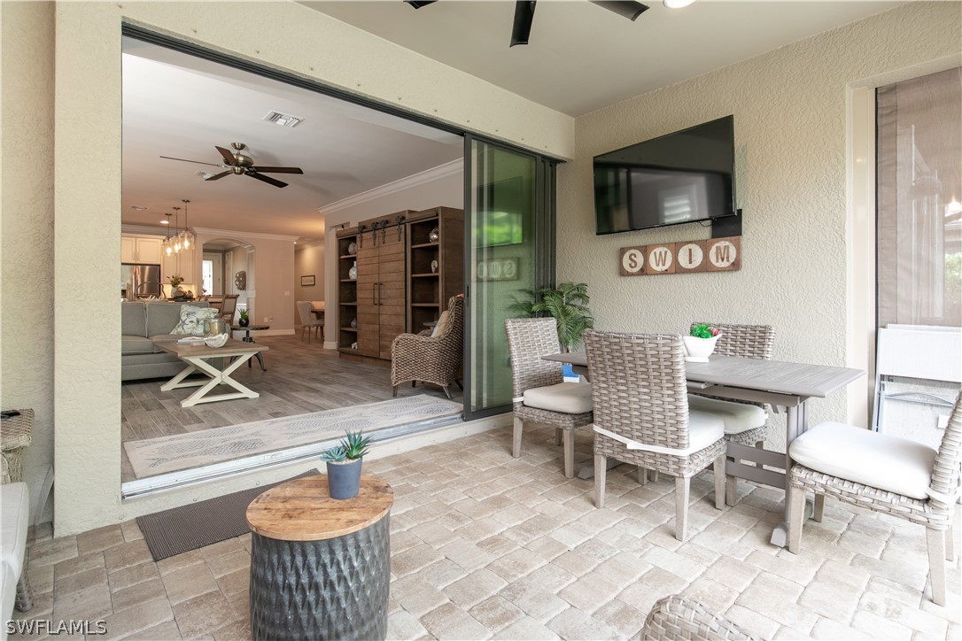 10832 Dennington Road Fort Myers, FL 33913 - Photo 23 of 34 a living room with furniture and a flat screen tv