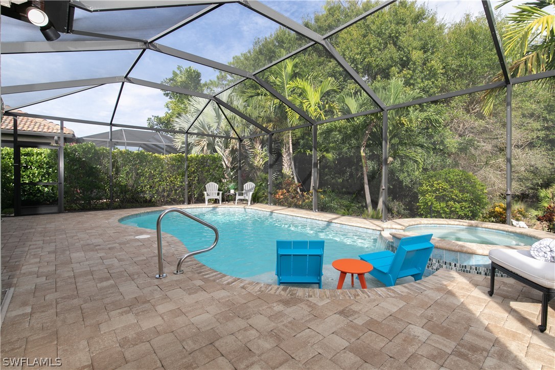 10832 Dennington Road Fort Myers, FL 33913 - Photo 24 of 34 a backyard of a house with table and chairs