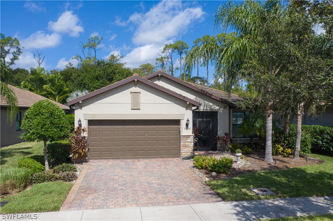 10832 Dennington Road Fort Myers, FL 33913 - Photo 30 of 34 a front view of house with yard and green space