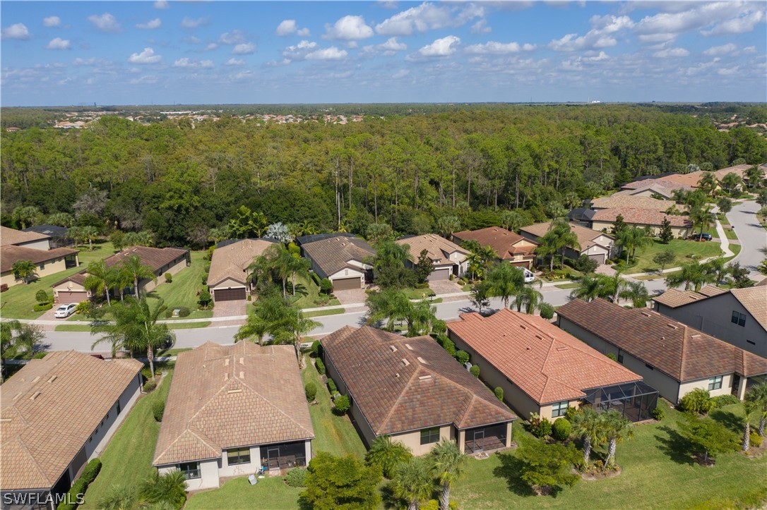 10832 Dennington Road Fort Myers, FL 33913 - Photo 31 of 34 an aerial view of residential houses with outdoor space and a lake view