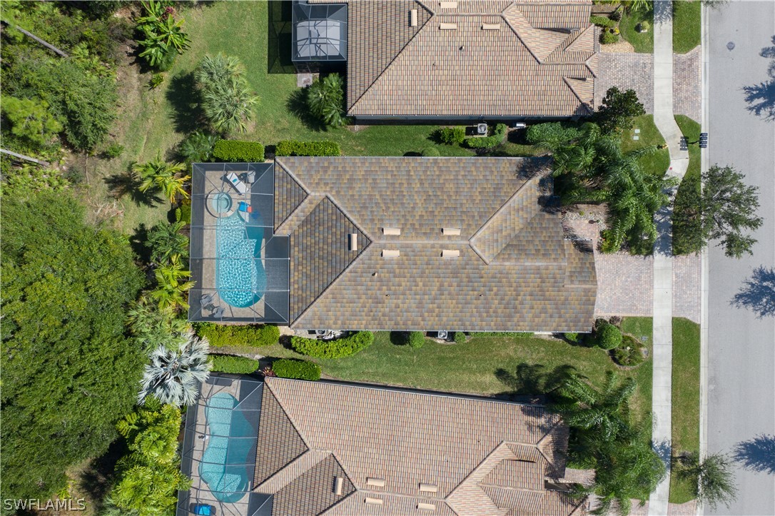 10832 Dennington Road Fort Myers, FL 33913 - Photo 32 of 34 an aerial view of a house with a yard and garden