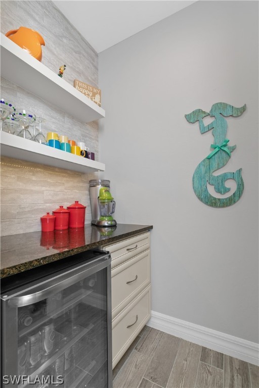 10832 Dennington Road Fort Myers, FL 33913 - Photo 5 of 34 a room with painting on the wall and a potted plant