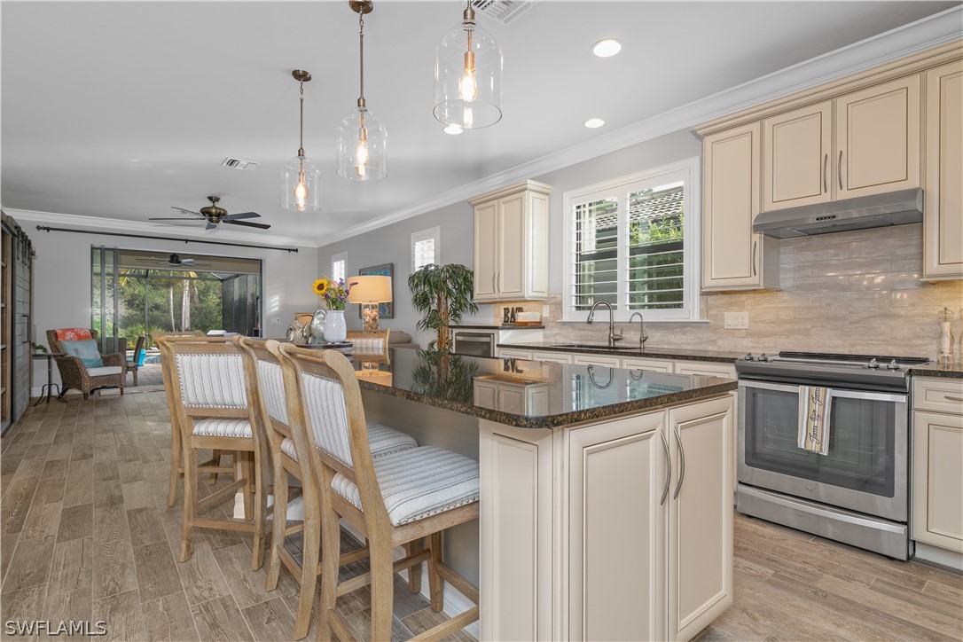 10832 Dennington Road Fort Myers, FL 33913 - Photo 9 of 34 a kitchen with granite countertop lots of counter top space and dining table