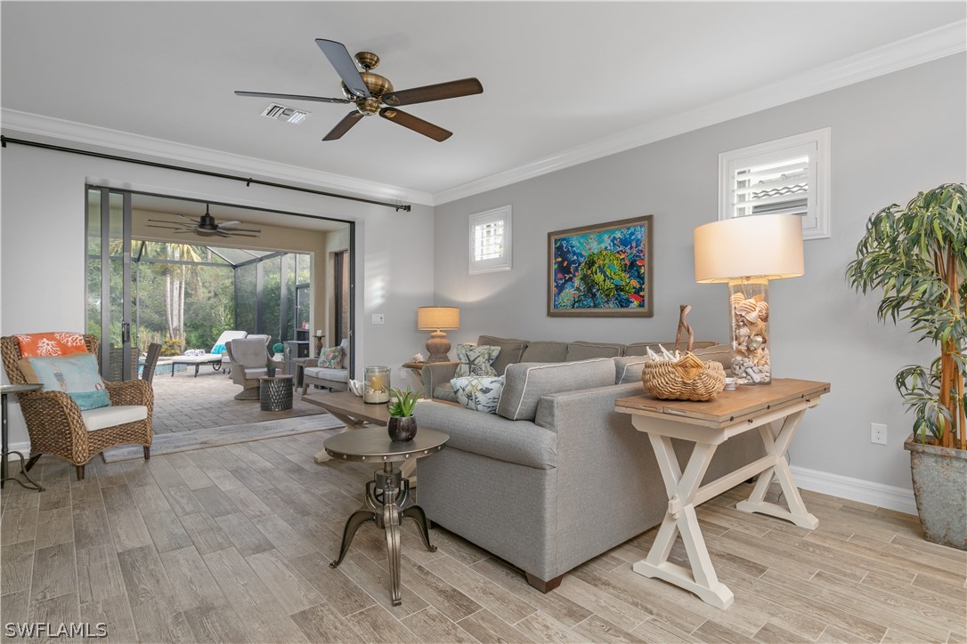 10832 Dennington Road Fort Myers, FL 33913 - Photo 10 of 34 a living room with furniture a table and a potted plant