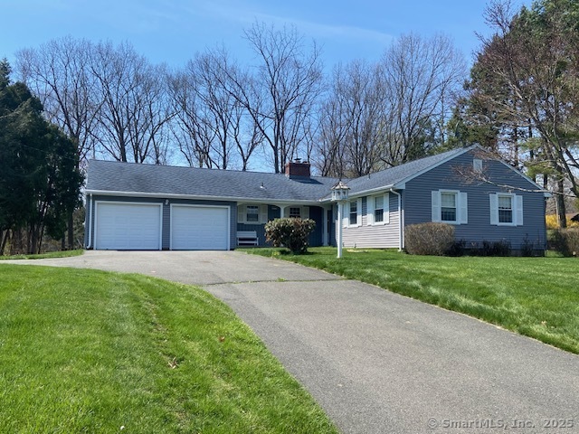 208 Moore Hill Drive Southington, CT 06489 - Photo 1 of 1 a front view of a house with a yard and garage