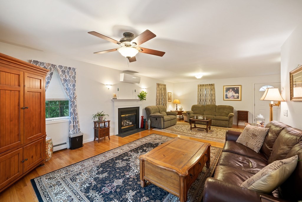 90 Greenwich Road Ware, MA 01082 - Photo 4 of 41 a living room with furniture a fireplace and a window