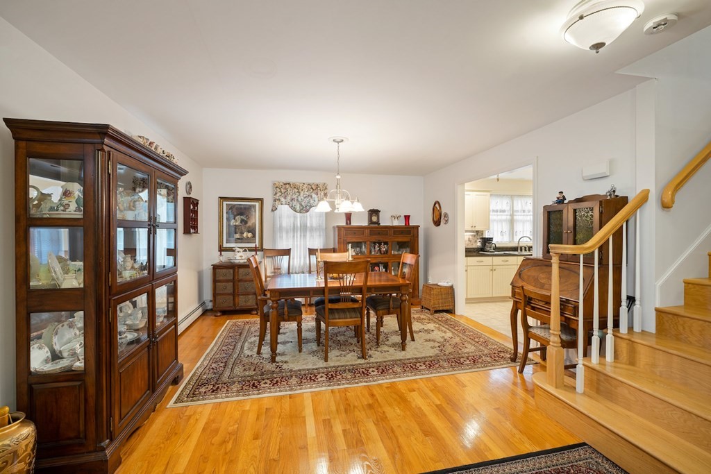 90 Greenwich Road Ware, MA 01082 - Photo 8 of 41 a view of a dining room with furniture and a book shelf