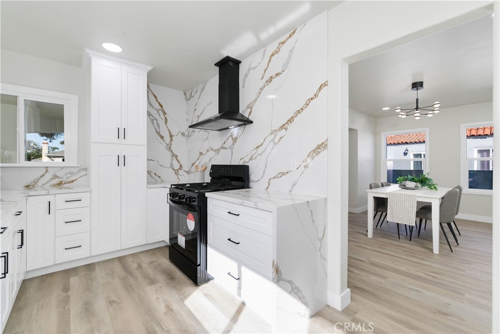 604 South Burris Avenue Compton, CA 90221 - Photo 12 of 25 a view of kitchen with furniture and wooden floor