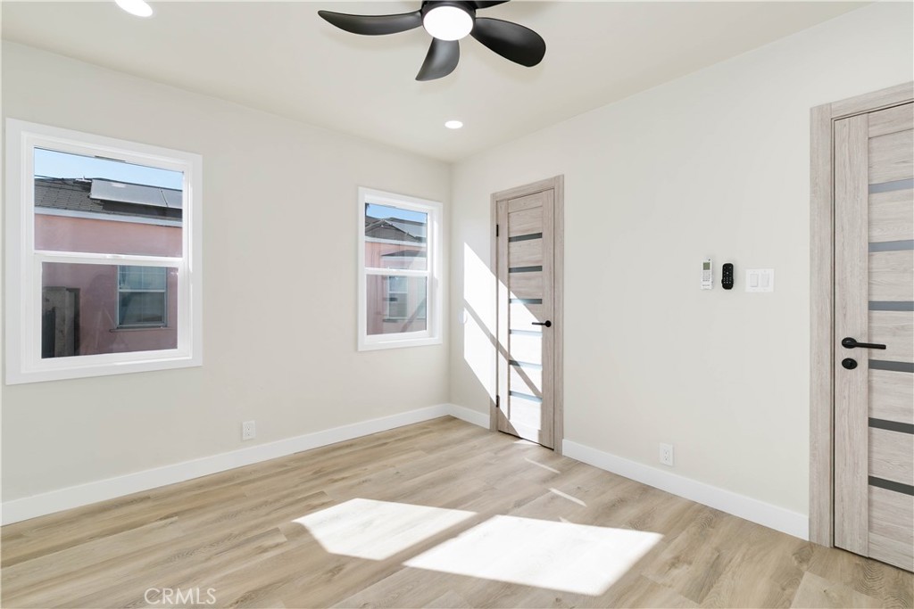 604 South Burris Avenue Compton, CA 90221 - Photo 19 of 25 wooden floor in an empty room with a window