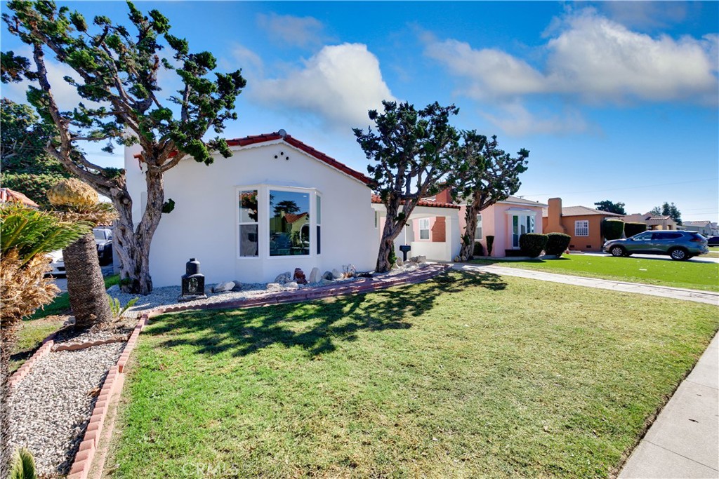 604 South Burris Avenue Compton, CA 90221 - Photo 3 of 25 a front view of a house with garden