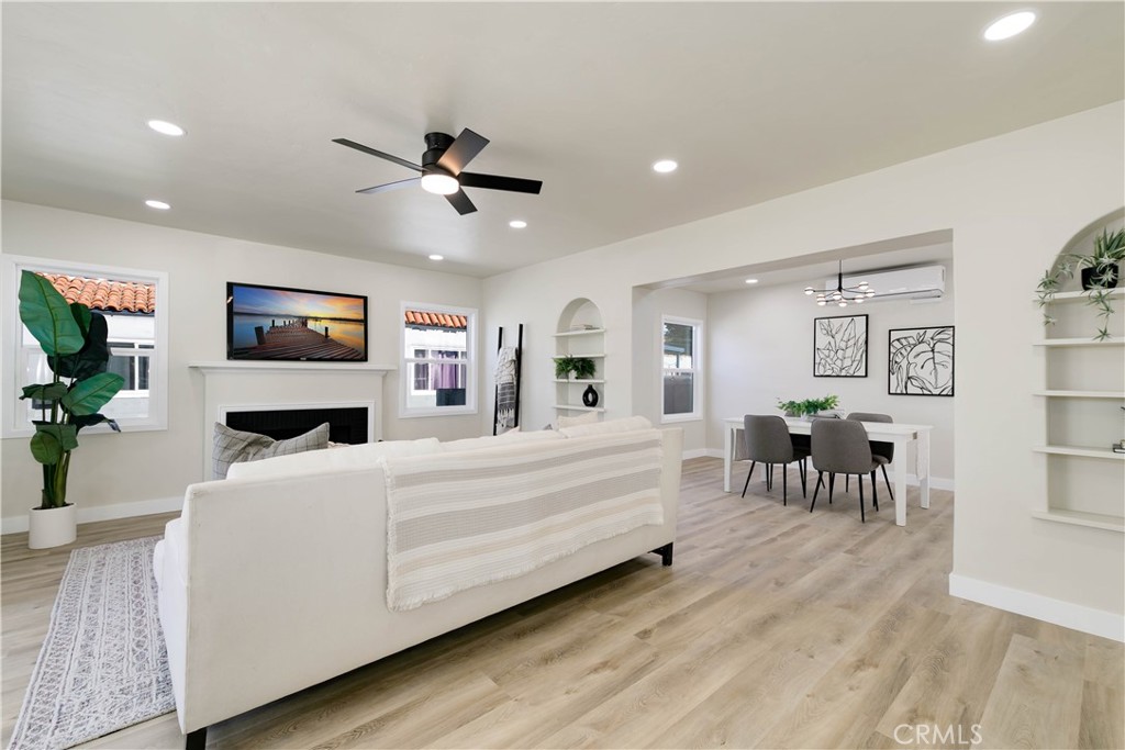 604 South Burris Avenue Compton, CA 90221 - Photo 5 of 25 a living room with furniture and a flat screen tv