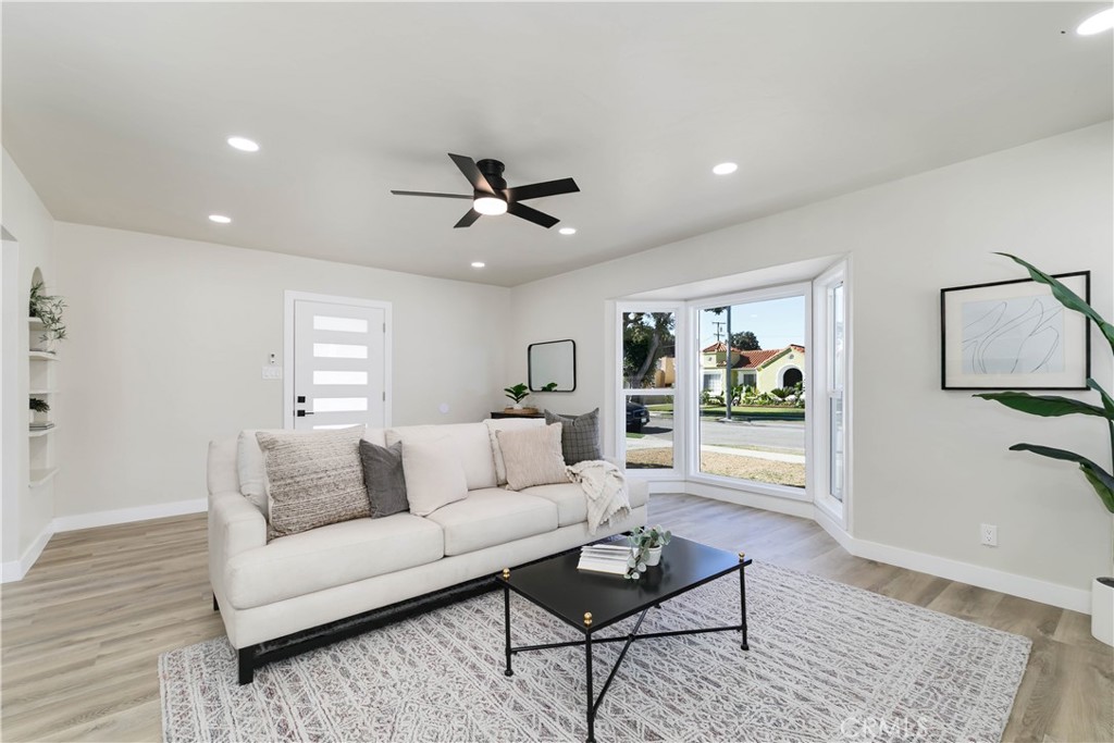 604 South Burris Avenue Compton, CA 90221 - Photo 7 of 25 a living room with furniture and a wooden floor