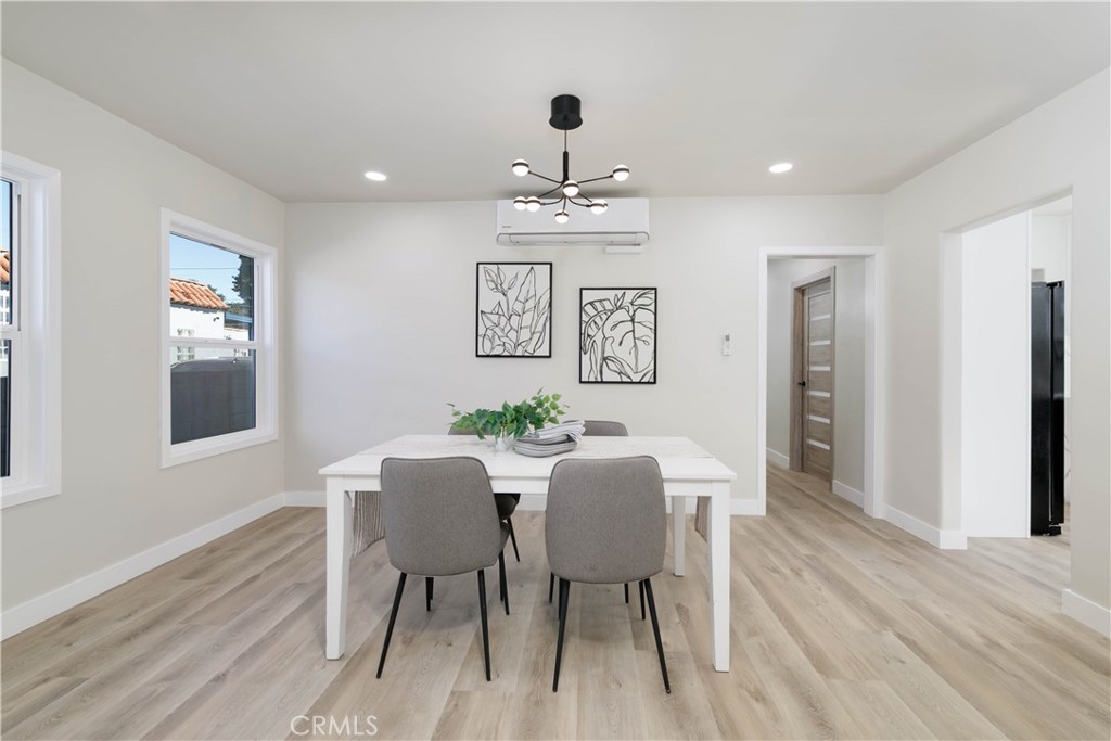 604 South Burris Avenue Compton, CA 90221 - Photo 8 of 25 a view of a dining room with furniture and wooden floor