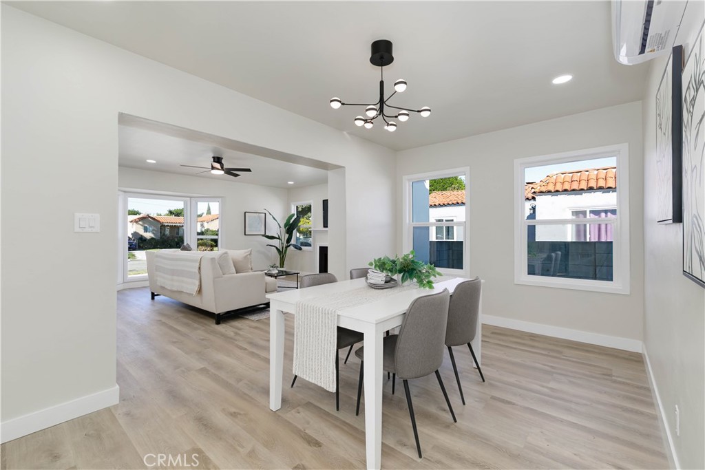 604 South Burris Avenue Compton, CA 90221 - Photo 9 of 25 a living room with furniture and a chandelier