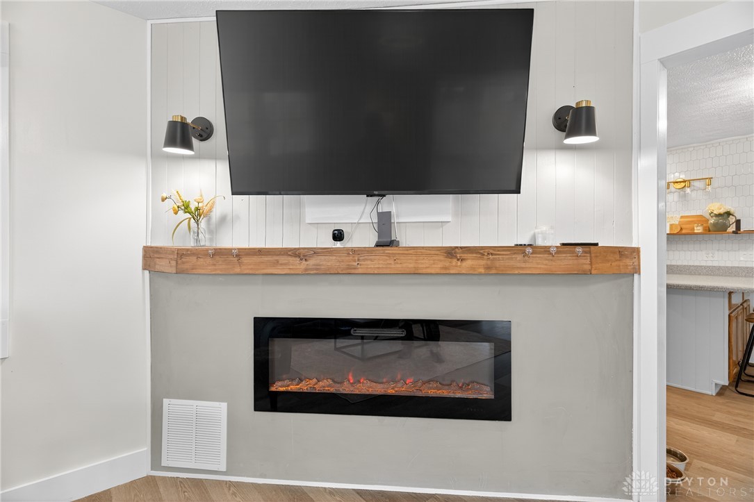 7888 Darke-Preble County Line Road Arcanum, OH 45304 - Photo 18 of 51 This inviting room boasts a contemporary fireplace with a sleek mantel, perfect for cozy gatherings.