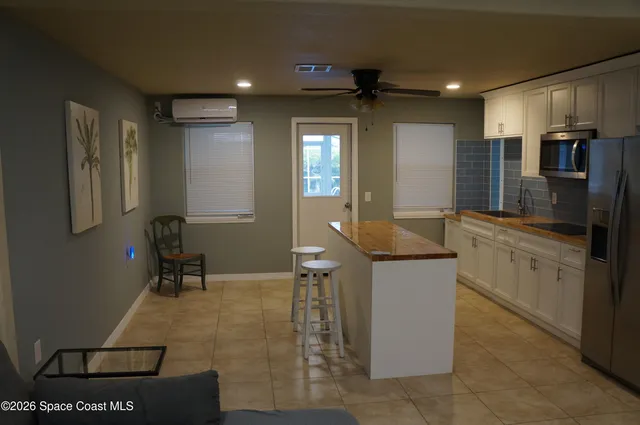 a kitchen with a sink stainless steel appliances and cabinets