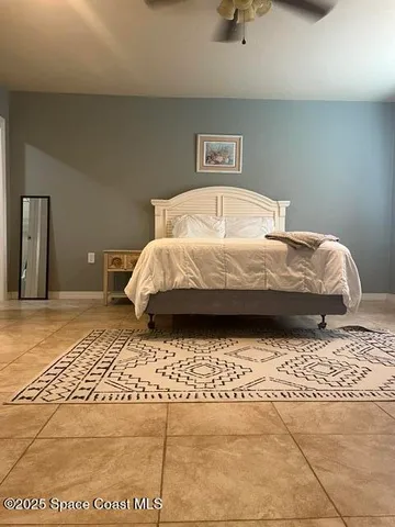 a bedroom with a bed and a walk in closet