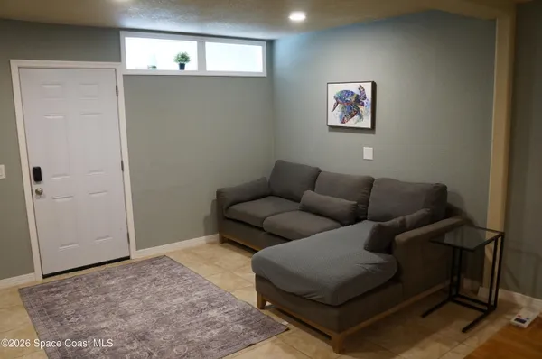 a living room with furniture and a rug