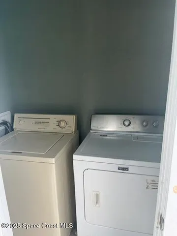 a utility room with dryer and washer