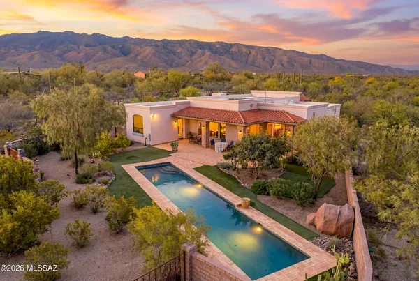 with aerial view of residential houses with outdoor space and mountain view