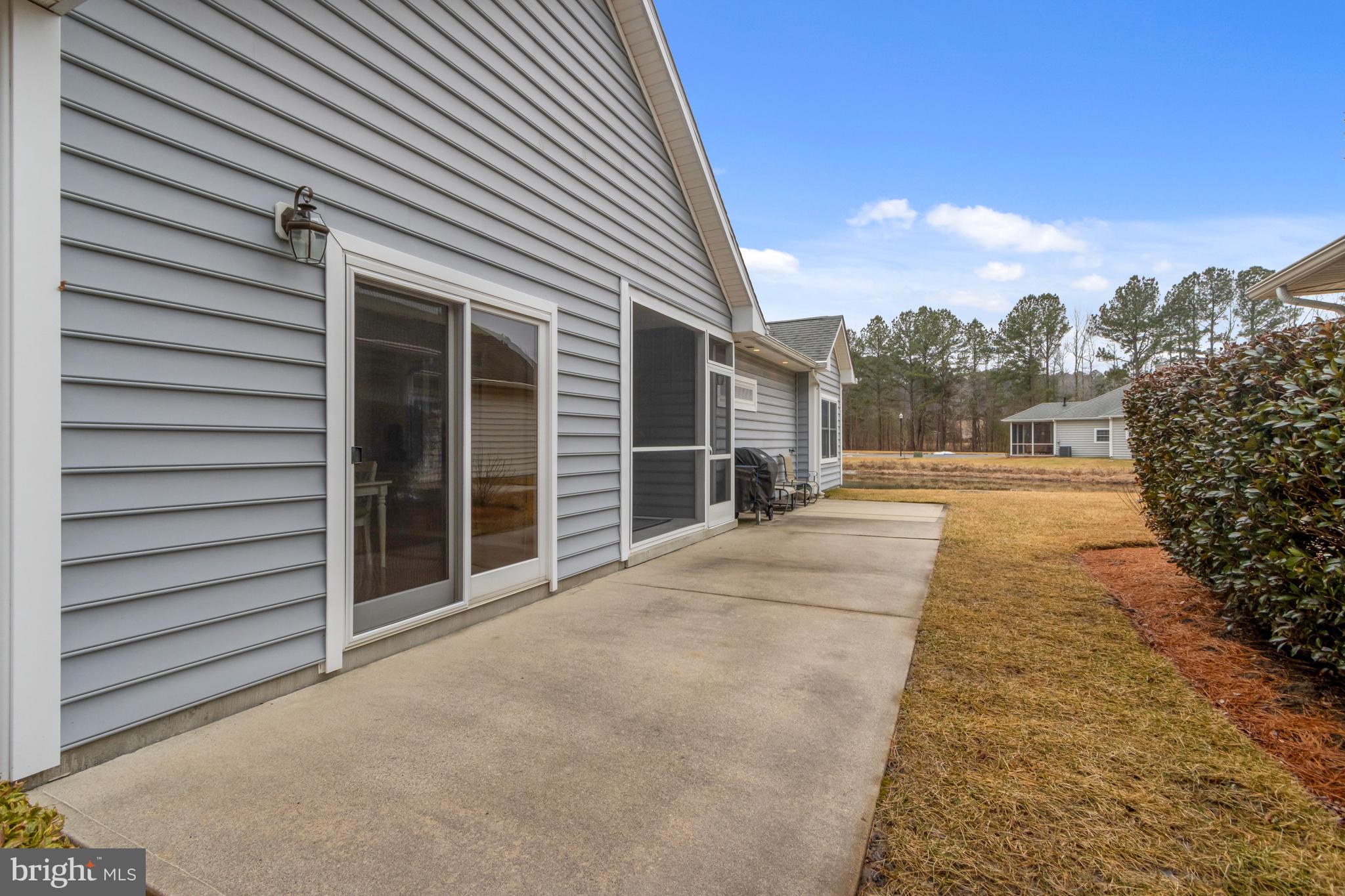 74 Cinder Way Georgetown, DE 19947 - Photo 46 of 54 Huge patio leading towards pond