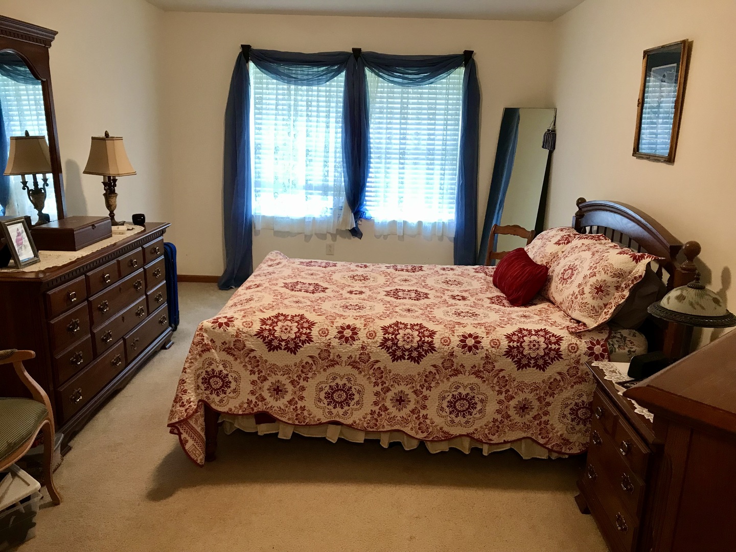 307 West Hudson Street Princeton, IL 61356 - Photo 19 of 23 a bedroom with a bed and a mirror on dresser