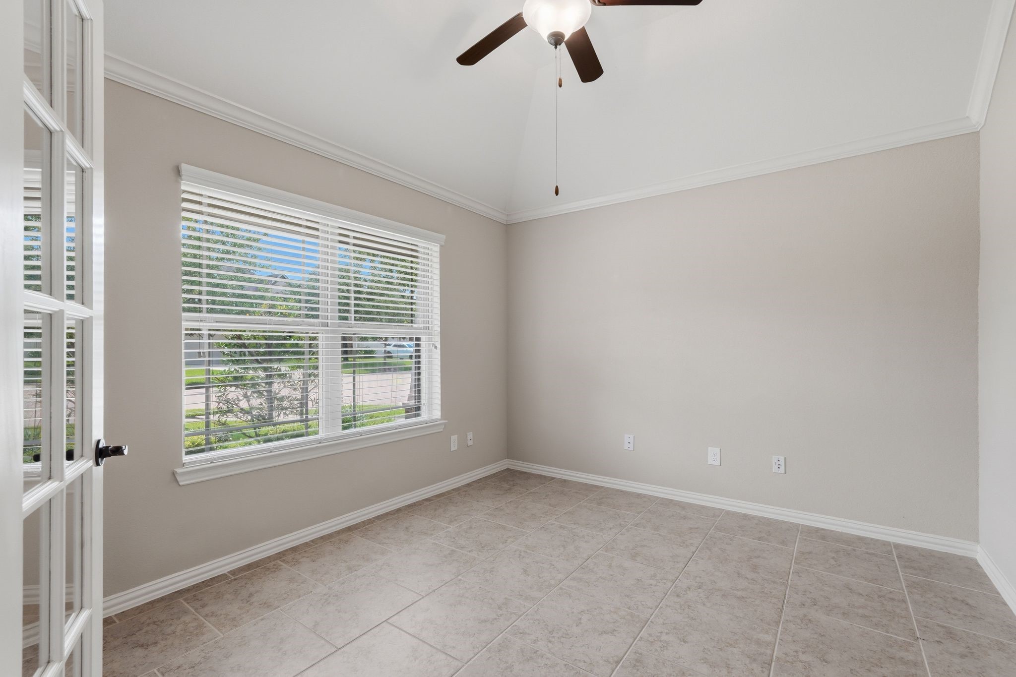 18227 Tacoma Ridge Drive Tomball, TX 77377 - Photo 5 of 45 Versatile front room filled with natural light, ideal for a home office or study.