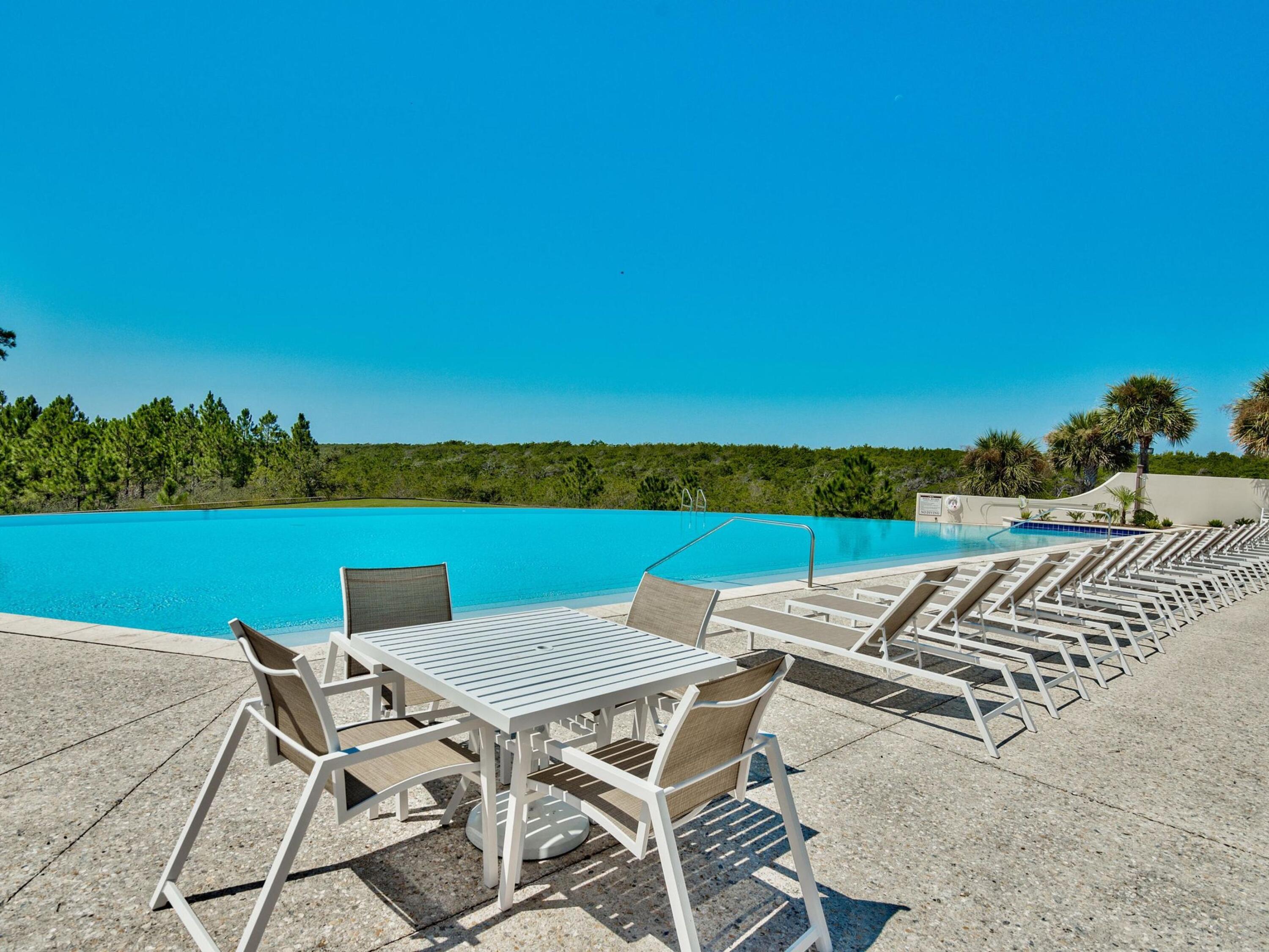 Lot 162 Gulf Walk Santa Rosa Beach, FL 32459 - Photo 32 of 48 a view of a chairs and table on the terrace