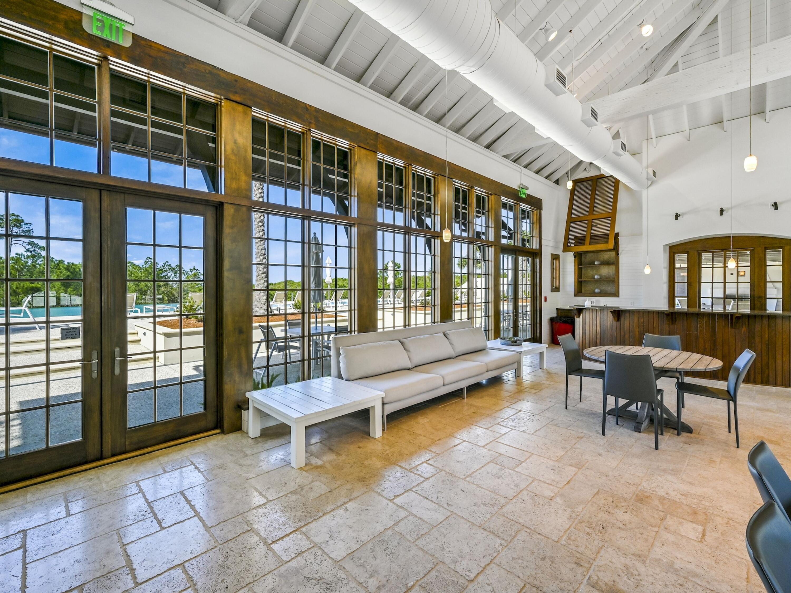 Lot 162 Gulf Walk Santa Rosa Beach, FL 32459 - Photo 36 of 48 a living room with furniture and a floor to ceiling window