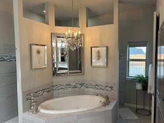 2321 Kimberly Lane Midlothian, TX 76065 - Photo 6 of 10 a bathroom with a tub and shower