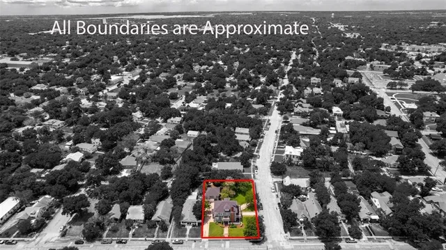 an aerial view of multiple houses with yard