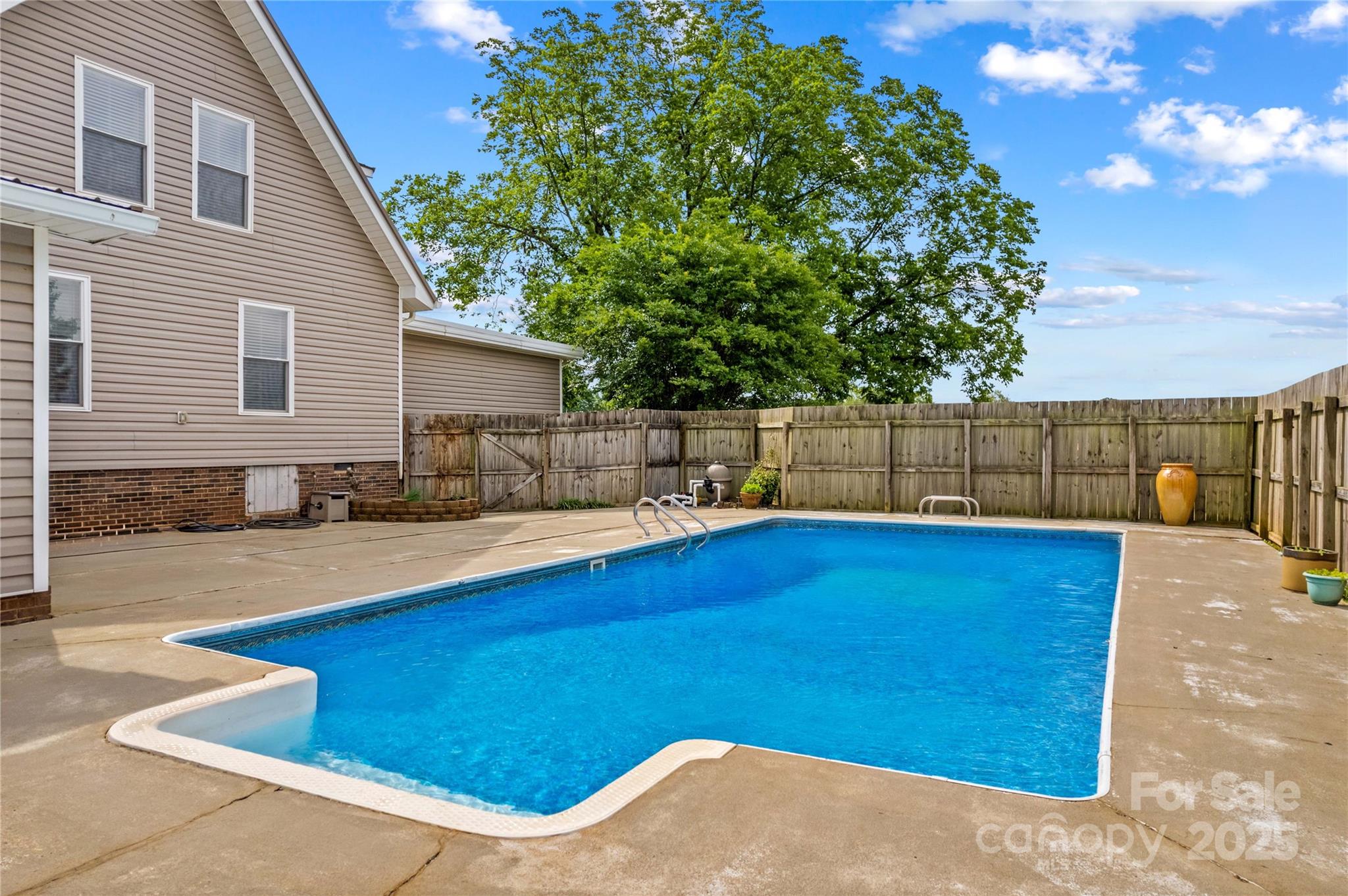 296 Hicks Creek Road Troutman, NC 28166 - Photo 26 of 48 a view of a backyard with swimming pool