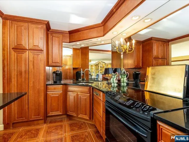 a kitchen with a sink appliances and cabinets