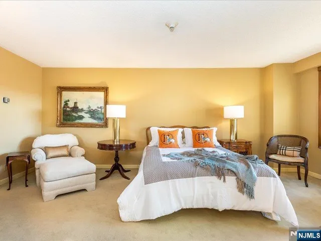 a bedroom with a bed and a couch