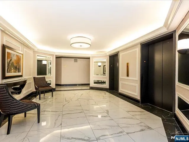 a view of a livingroom with furniture and windows