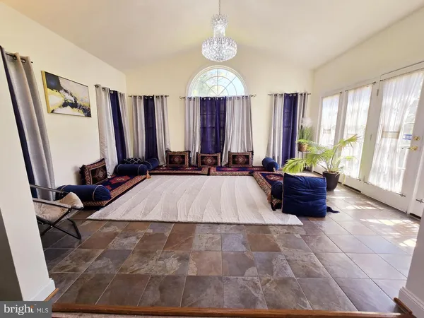 a bed room with a bed and a television
