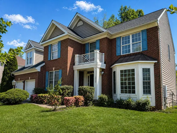 front view of a house with a yard